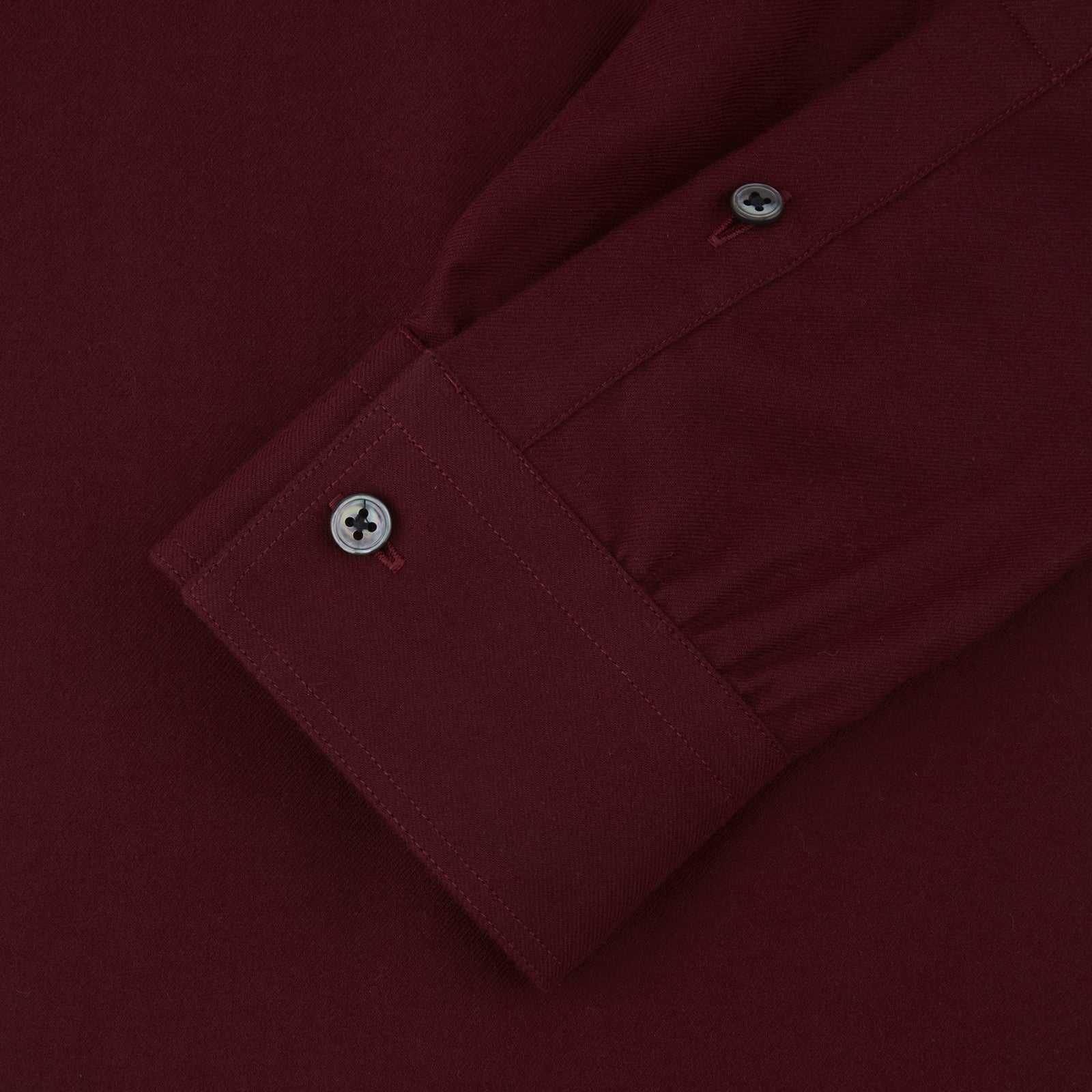 View 3 of product The Turnbull & Asser Burgundy Cashmerello Button Down Shirt features long sleeves, buttoned chest pockets, a spread collar, and is crafted from a soft cotton-cashmere blend, neatly displayed on a plain white background.