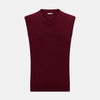View 1 of product The Turnbull & Asser Burgundy Cashmere V-Neck Vest for men is a stylish, sleeveless knit sweater displayed on a plain white background.