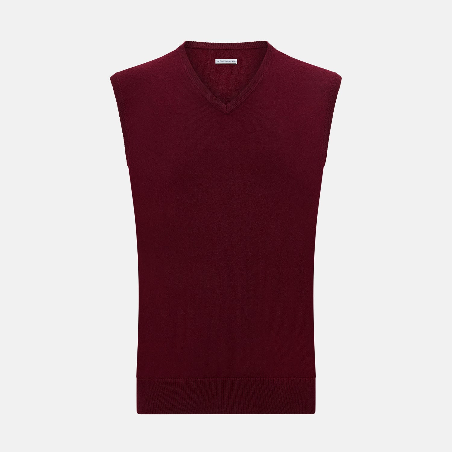 View 1 of product The Turnbull & Asser Burgundy Cashmere V-Neck Vest for men is a stylish, sleeveless knit sweater displayed on a plain white background.