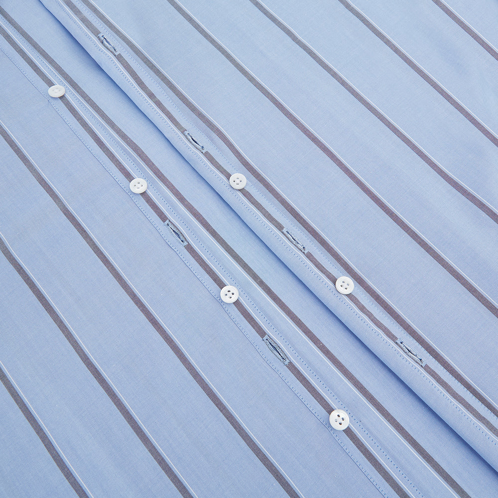 The Sky Blue Track Stripe Westminster Shirt by Turnbull & Asser features long sleeves, a Turnbull collar, and vertical dark blue and white stripes, displayed flat on a white surface.