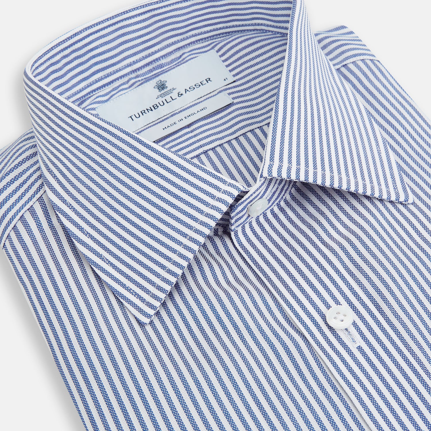 View 2 of product The Turnbull & Asser Navy Bengal Stripe Mayfair Shirt is a long-sleeved, collared formal shirt with blue and white stripes, white buttons, and buttoned cuffs—ideal for classic style enthusiasts. Displayed on a plain white background.