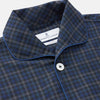 View 2 of product The Turnbull & Asser Blue Multi Check Wool Quin Pyjama Set features a long-sleeve button-up top with chest pocket and drawstring pants, both displayed flat on white—a luxurious choice for refined sleepwear.