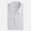View 5 of product The Blue and Red Graph Check Westminster Shirt by Turnbull & Asser features a classic collar, long sleeves, and British craftsmanship, with a blue and red checkered pattern on white, displayed flat on a white surface.