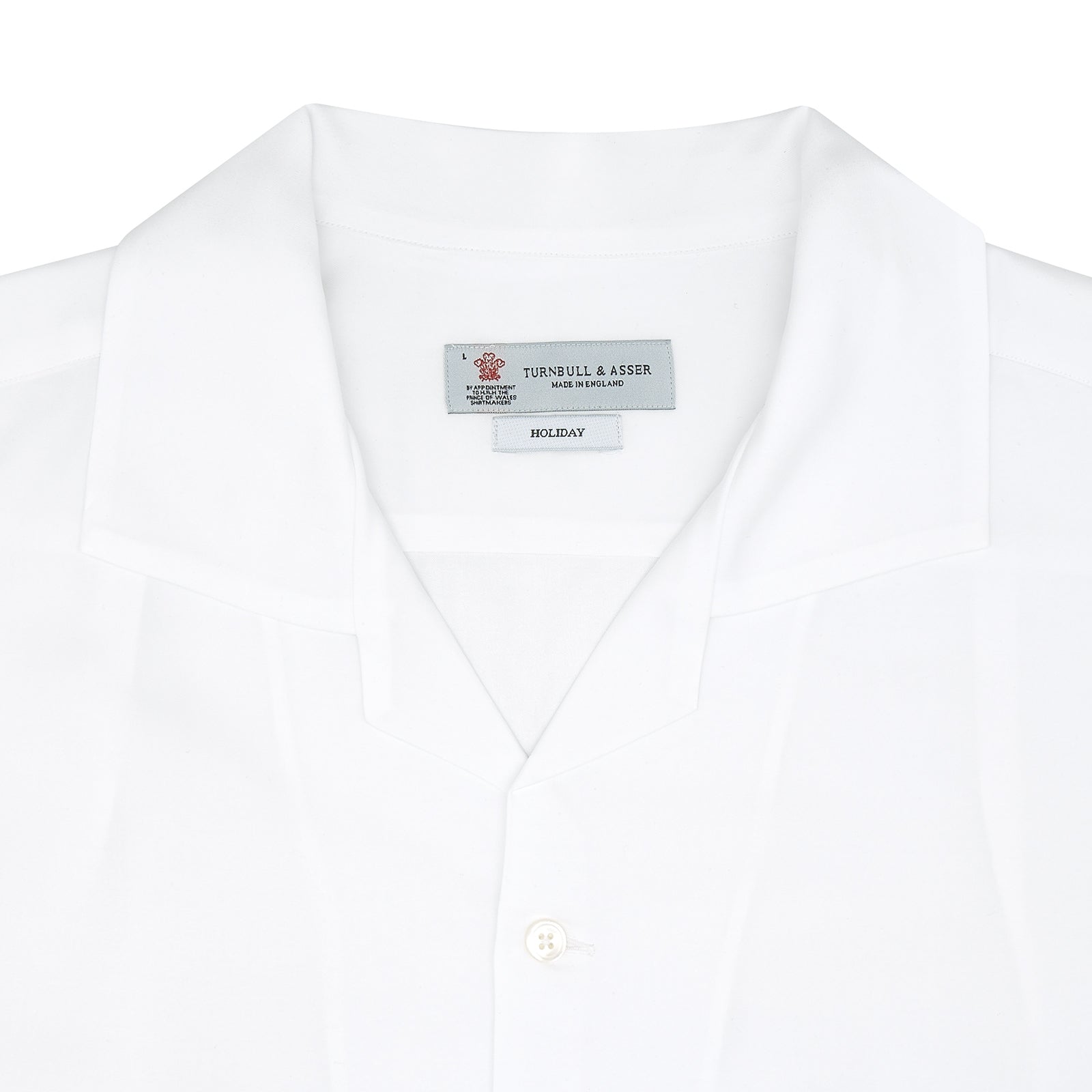 View 3 of product The White Lyocell Hampton Open Collar Shirt by Turnbull & Asser is neatly folded with visible label, notched collar, and buttons, displayed against a light grey background.