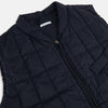 View 2 of product The Turnbull & Asser Navy Quilted Gilet is sleeveless and lightweight, with a front zipper, zippered side pockets, chest pocket, and rounded hem—ideal for versatile layering. Shown on a plain white background.