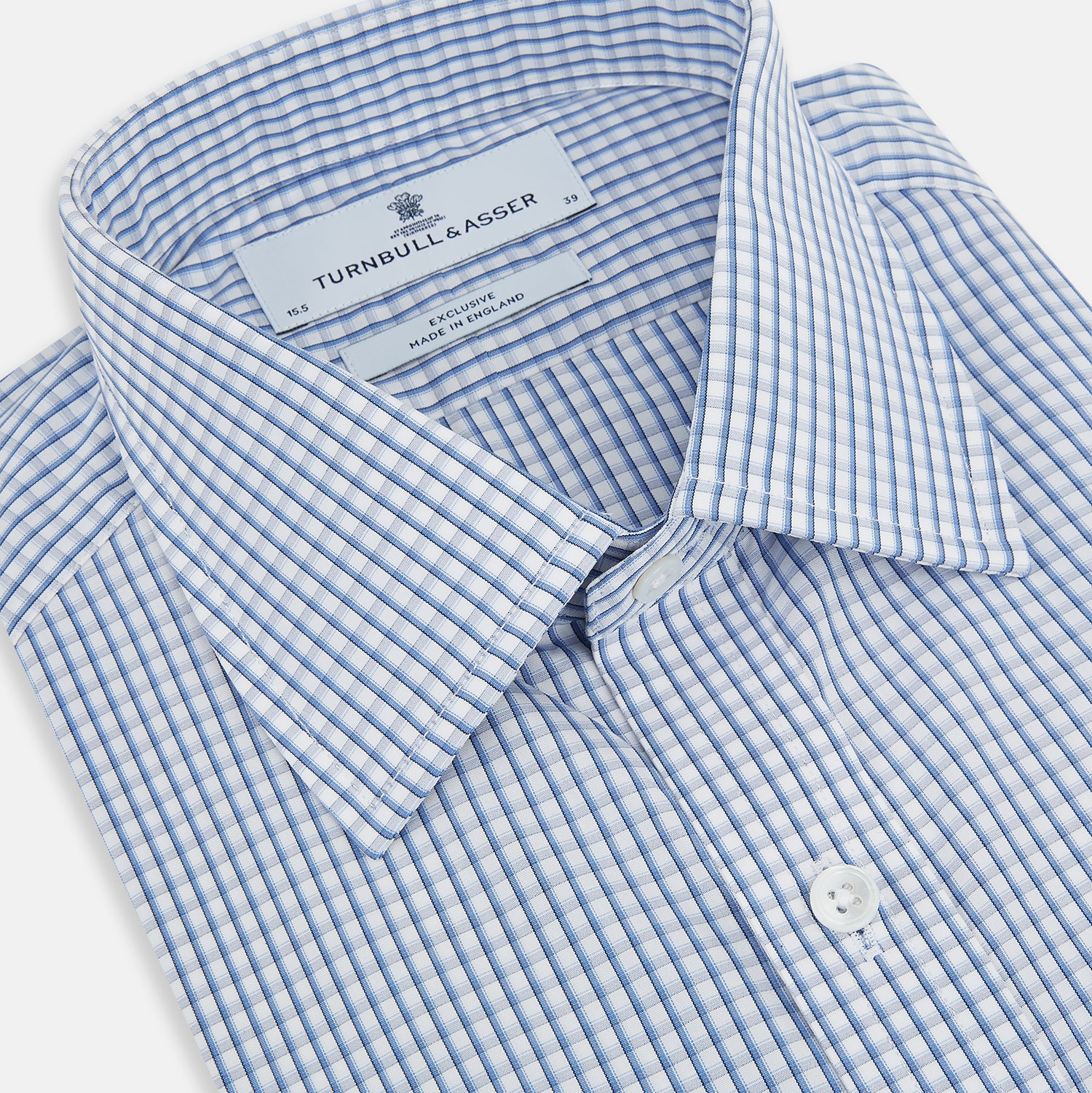 View 2 of product The Sky Blue Micro Shadow Check Mayfair Shirt by Turnbull & Asser features long sleeves, a classic collar, buttoned cuffs, and a light blue and white micro check pattern—showcasing refined British craftsmanship.
