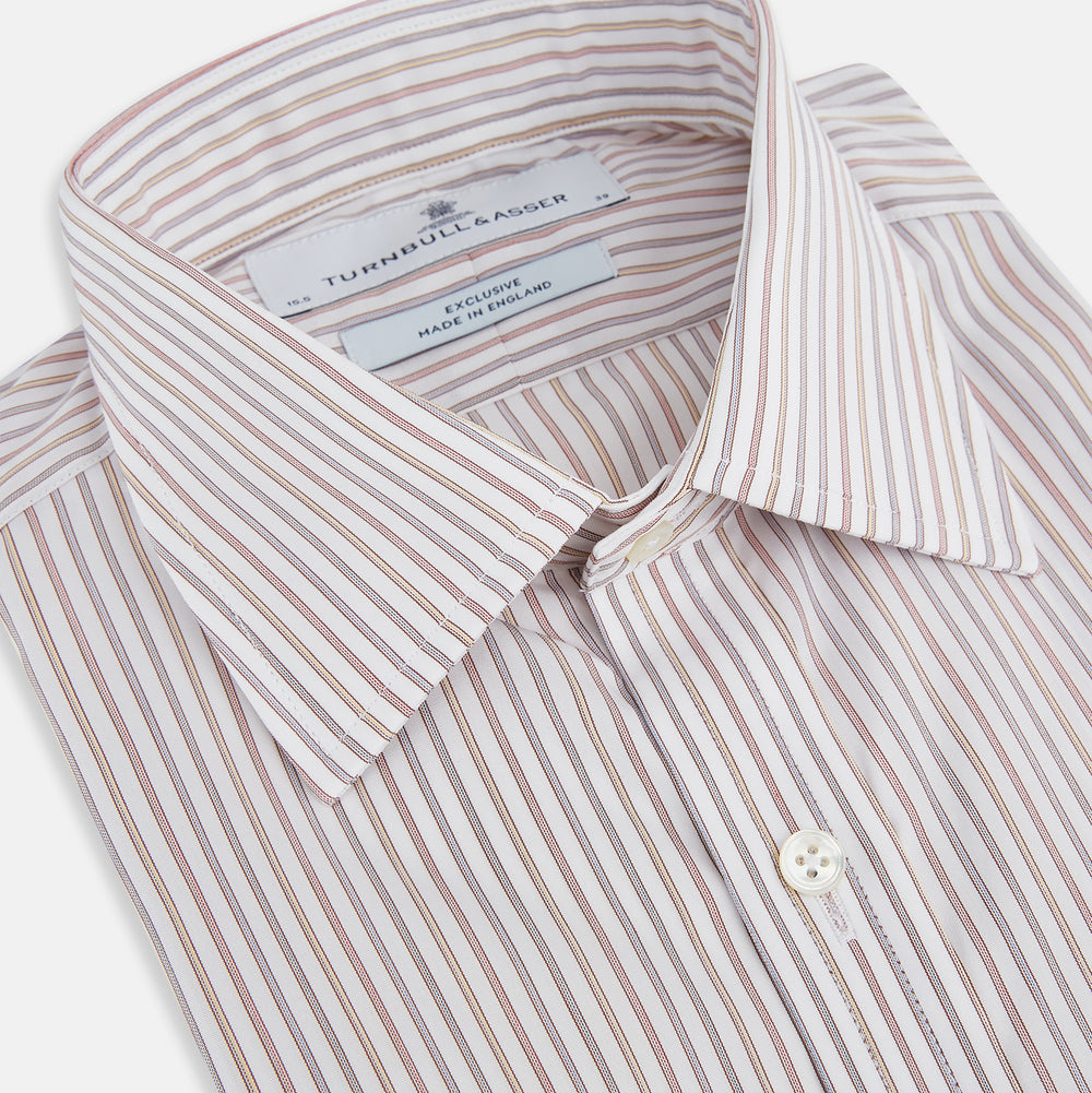 The Red with Multicoloured Music Stripe Mayfair Shirt by Turnbull & Asser is a long-sleeve, button-up shirt with a collar, featuring vibrant multicoloured stripes, inspired by classic British design, neatly laid flat on a plain background.