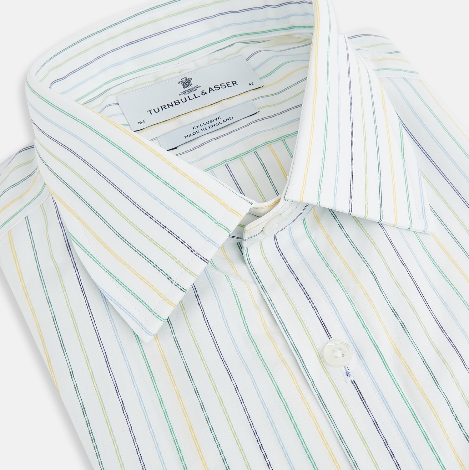 View 2 of product The Turnbull & Asser Multi Tone Double Pinstripe Mayfair Shirt is a long-sleeve pure cotton shirt with a collar and thin blue, green, and yellow double pinstripes on a white background.