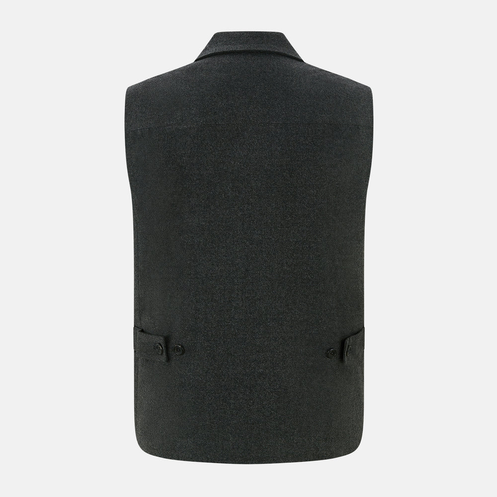The Graphite Melange Collared Single-breasted Waistcoat by Turnbull & Asser features a dark gray hue, front buttons, collar, two zippered side pockets, and a chest pocket—perfect for winter. Shown on a plain white background.