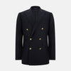 View 1 of product The Turnbull & Asser Long Navy Double Breasted Classic Blazer features peak lapels, six gold buttons, flap pockets, and a chest pocket—showcasing classic British tailoring against a plain light background.