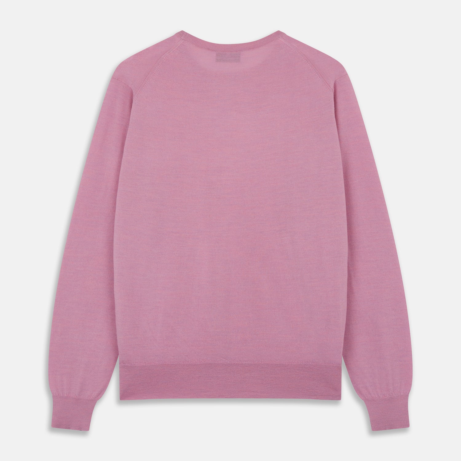 View 4 of product Wearing Turnbull & Asser’s Pink Merino Kingston Crew Neck Jumper, white pants, and a colorful scarf, a person stands against a plain light gray background with hands in their pockets.
