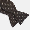View 3 of product A stylish accessory, the White and Brown Micro Dot Silk Bow Tie by Turnbull & Asser features tiny brown dots on luxurious white silk, elegantly displayed against a plain white background.