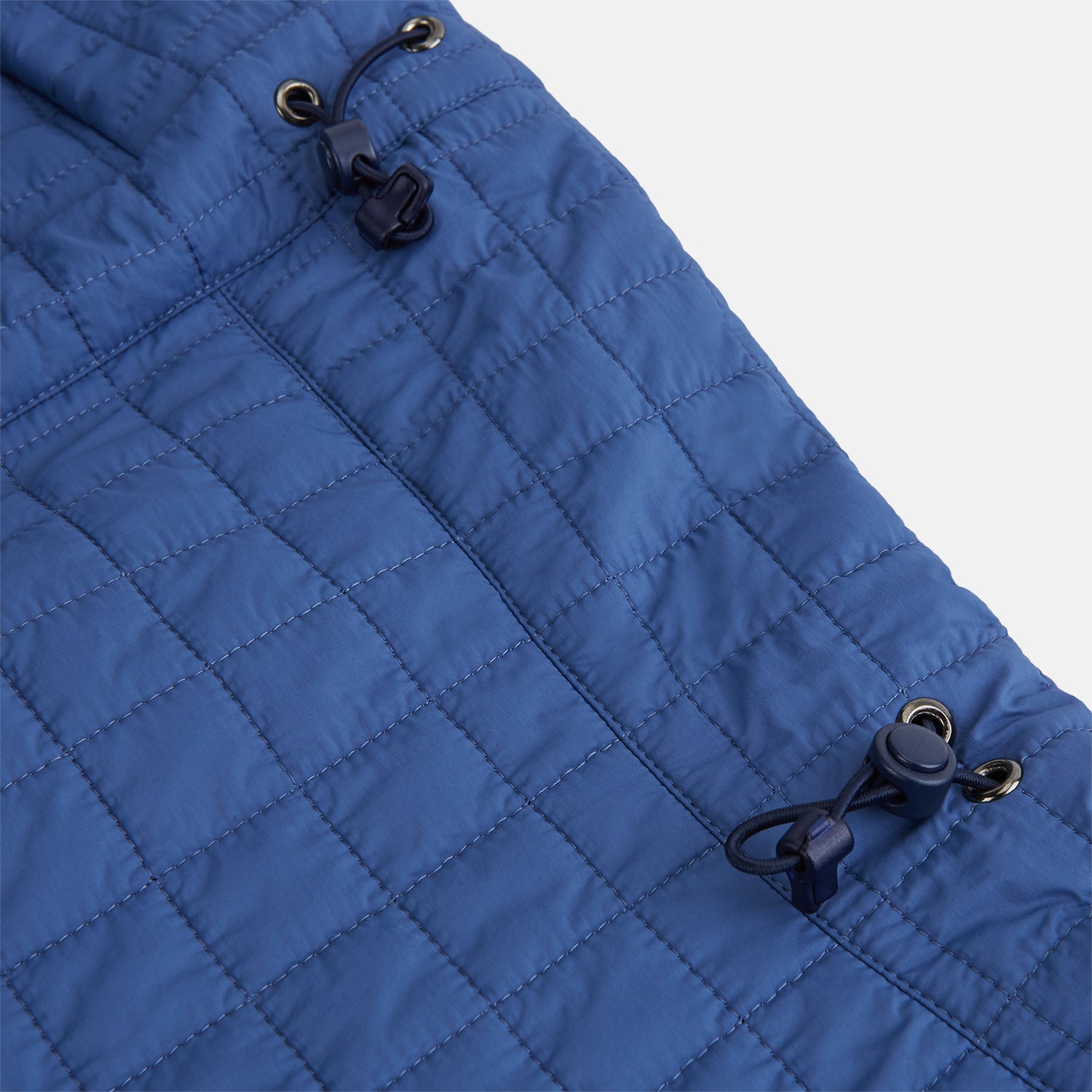 View 6 of product The Turnbull & Asser Azzurro Quilted Hood with Neck Warmer features a grid-stitched pattern, button closure, and overlapping front for added style. It draws inspiration from classic quilted jackets and is shown on a plain white background.
