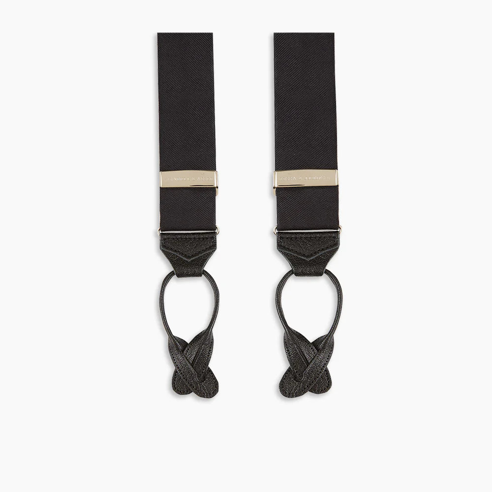 Turnbull & Asser Black Herringbone Adjustable Silk Braces feature leather button loops and silver adjusters—ideal for refined sartorial style. Displayed on a white background.