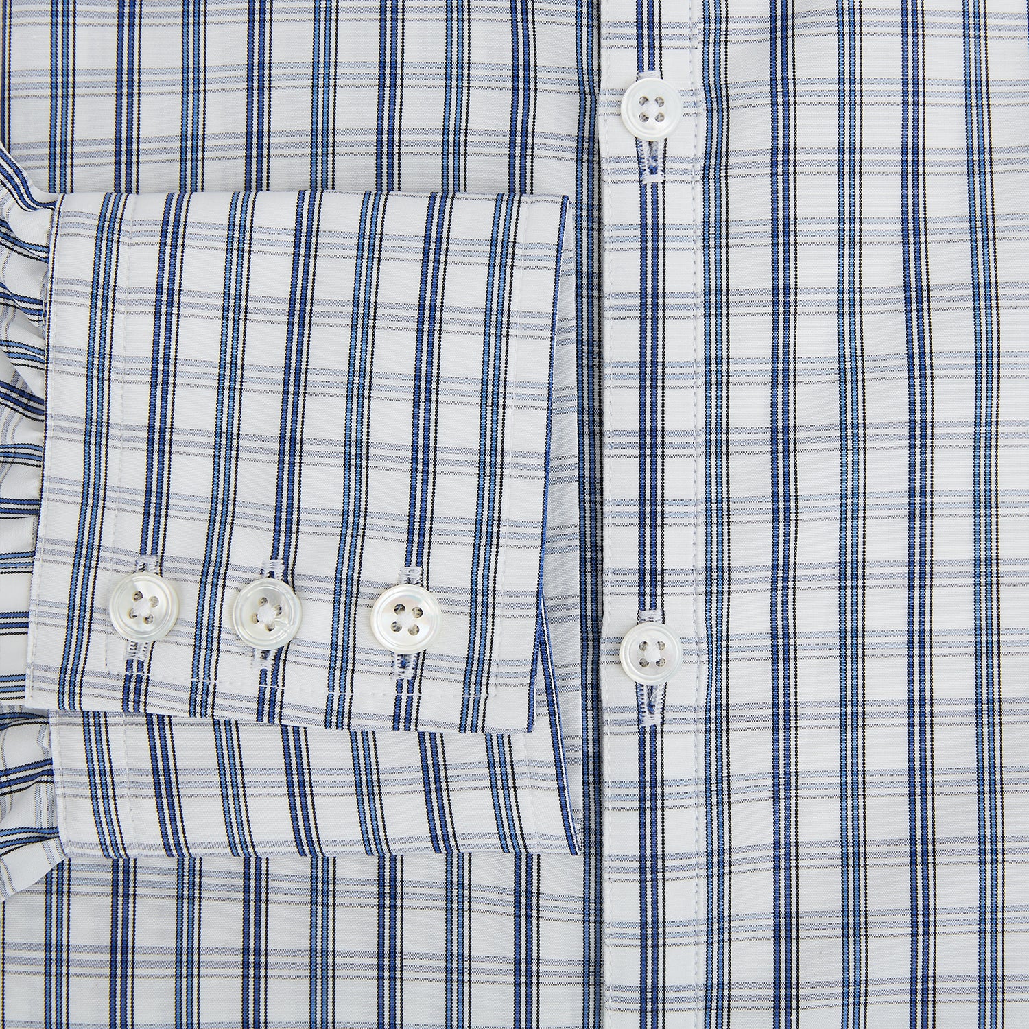 View 4 of product The Azzurro Multi Check Westminster Shirt by Turnbull & Asser is a long-sleeve, button-up with a white base and blue and gray checks, displayed flat against a white background.