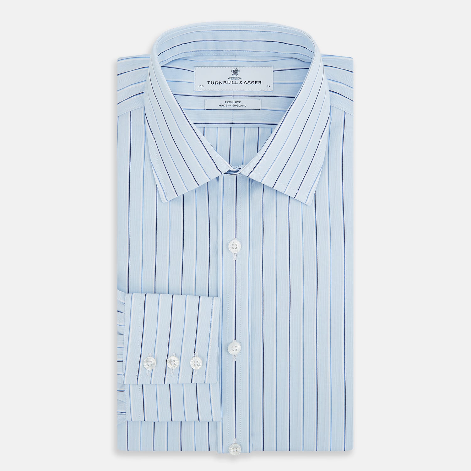 View 5 of product The Turnbull & Asser Navy and Blue Combination Stripe Mayfair Shirt, featuring thin vertical stripes and a classic collar, is displayed laid flat on a white background.