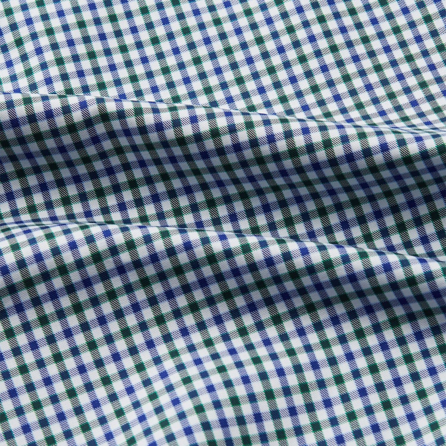 View 4 of product The Turnbull & Asser Green and Blue Cotton Multi Check Weekend Fit Finch Shirt features long sleeves, a pointed collar, and buttoned cuffs—perfect for versatile style. Laid flat on a white background.