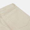 View 2 of product A pair of Turnbull & Asser Ecru Sanforized Denim Jeans with five pockets, button closure, and silver rivets, shown against a plain white background.