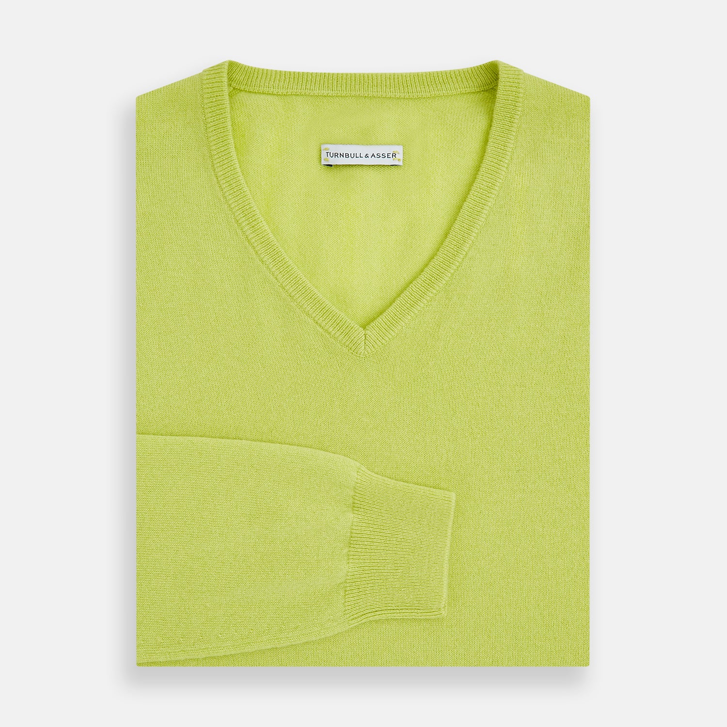 View 4 of product The Lemon Green Cashmere V-neck Jumper by Turnbull & Asser features ribbed cuffs and hem—an essential long sleeve knitwear piece, shown against a white background.