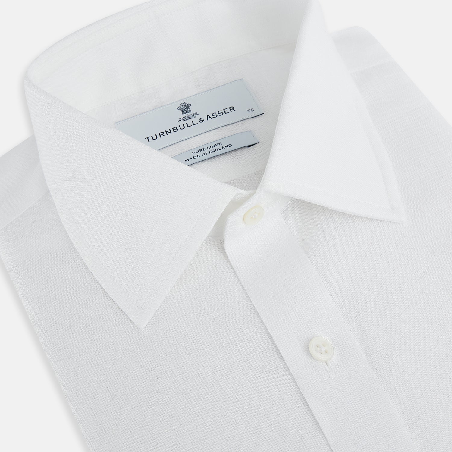 View 2 of product The Turnbull & Asser White Linen Mayfair Shirt features long sleeves and a classic collar, shown on a flat white background.
