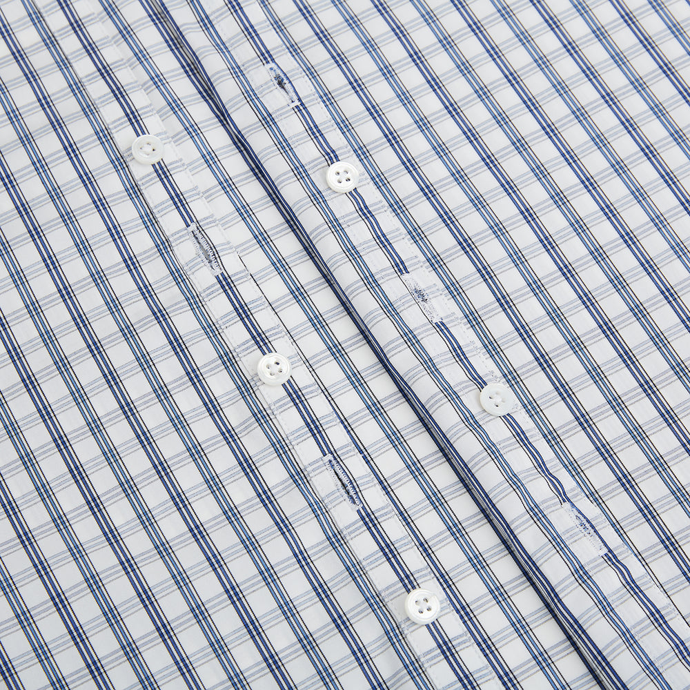 The Azzurro Multi Check Westminster Shirt by Turnbull & Asser is a long-sleeve, button-up with a white base and blue and gray checks, displayed flat against a white background.