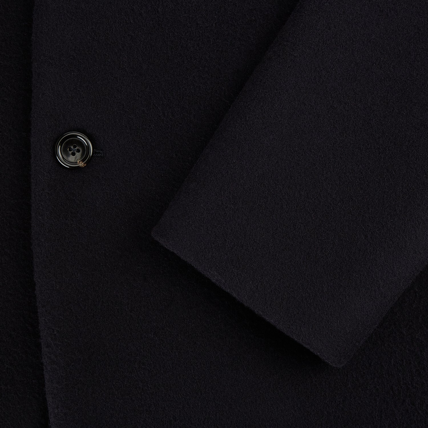 View 4 of product The Navy Apsley Single-Breasted Caban Coat by Turnbull & Asser features three buttons, notch lapels, a chest pocket, and two front flap pockets, shown against a plain light gray background.