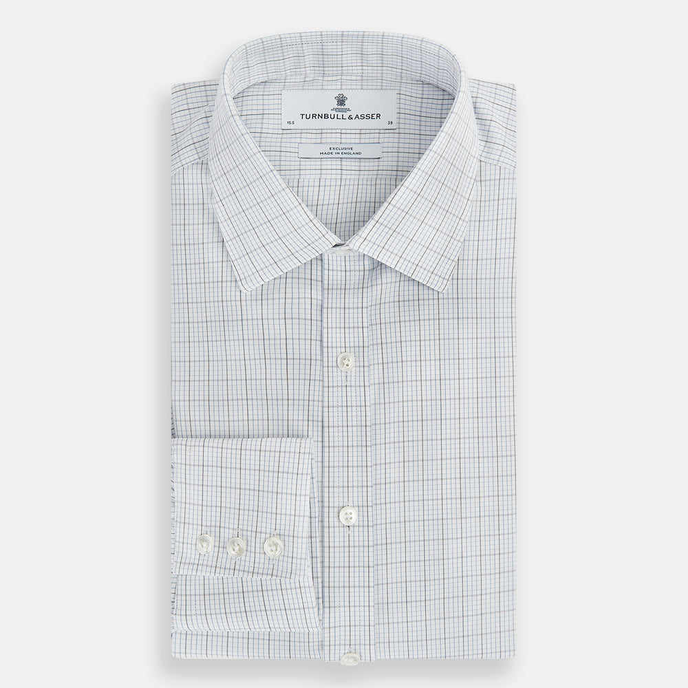 The Turnbull & Asser Navy and Blue Multi Grid Check Mayfair Shirt is a long-sleeve, button-up Italian cotton shirt with a collar and cuffs, featuring a blue grid check pattern, shown against a plain white background.