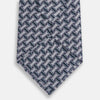 View 3 of product The Turnbull & Asser Navy and Pink Weave Patterned Silk Tie is shown elegantly rolled up on a white background.
