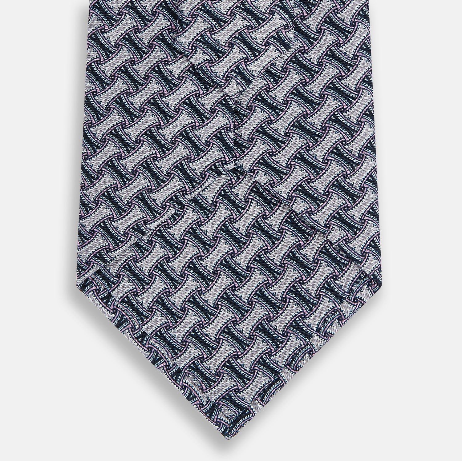 View 3 of product The Turnbull & Asser Navy and Pink Weave Patterned Silk Tie is shown elegantly rolled up on a white background.