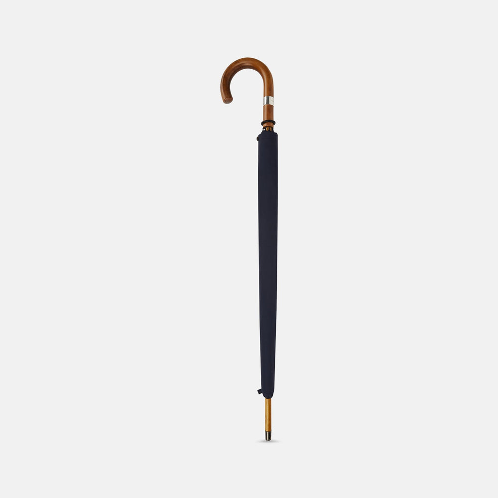 The Turnbull & Asser Navy Traveller Umbrella features a Malacca crook handle and is shown open against a plain white background.