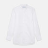 View 1 of product The White Cotton Lauren Shirt by Turnbull & Asser, featuring a stand collar, button-down front, and elongated body, is laid flat on a plain white background.