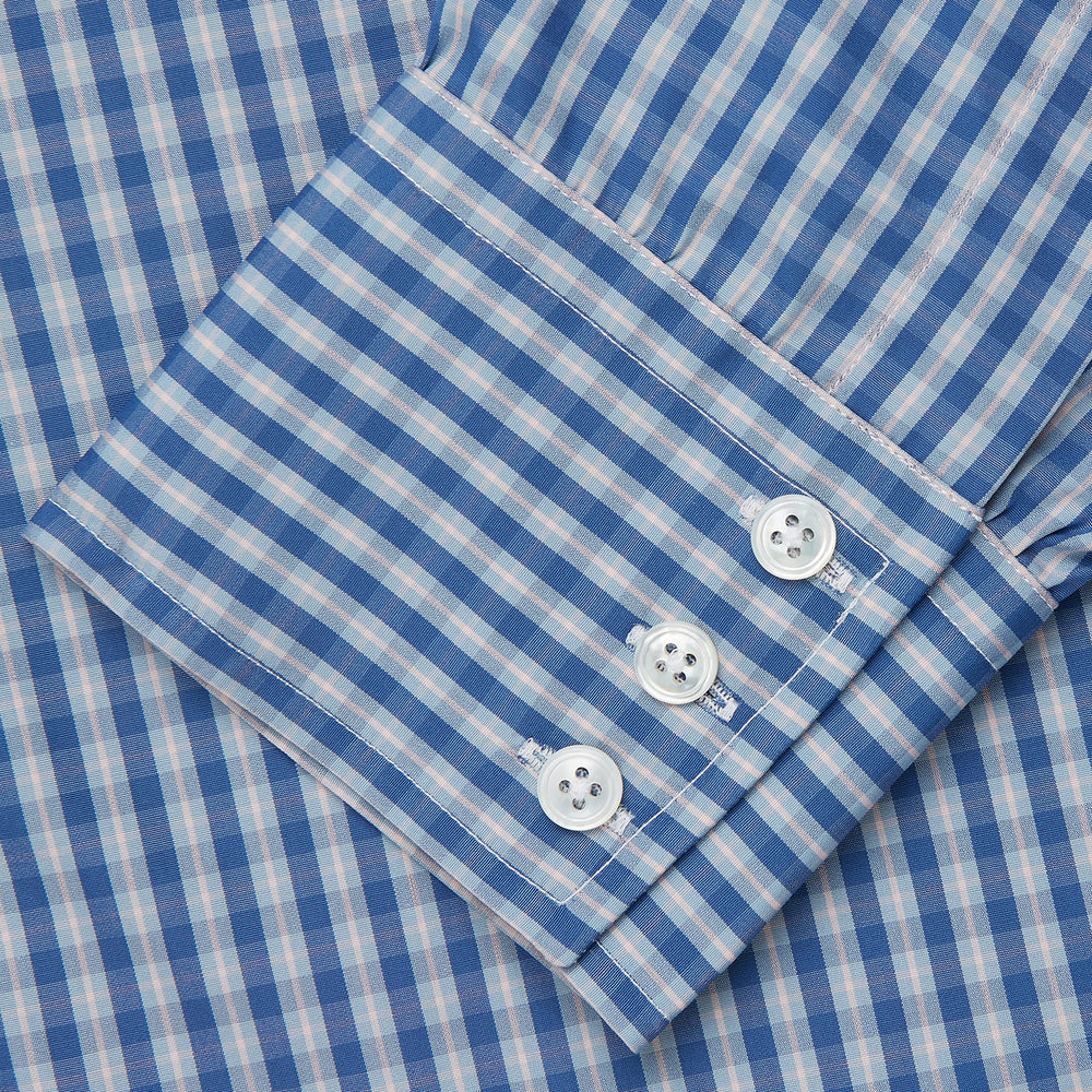 The Turnbull & Asser Navy Multi Check Cotton Regular Fit Mayfair Shirt features long sleeves, button-down front, collar, and buttoned cuffs in a navy and white check pattern, shown against a plain white background.