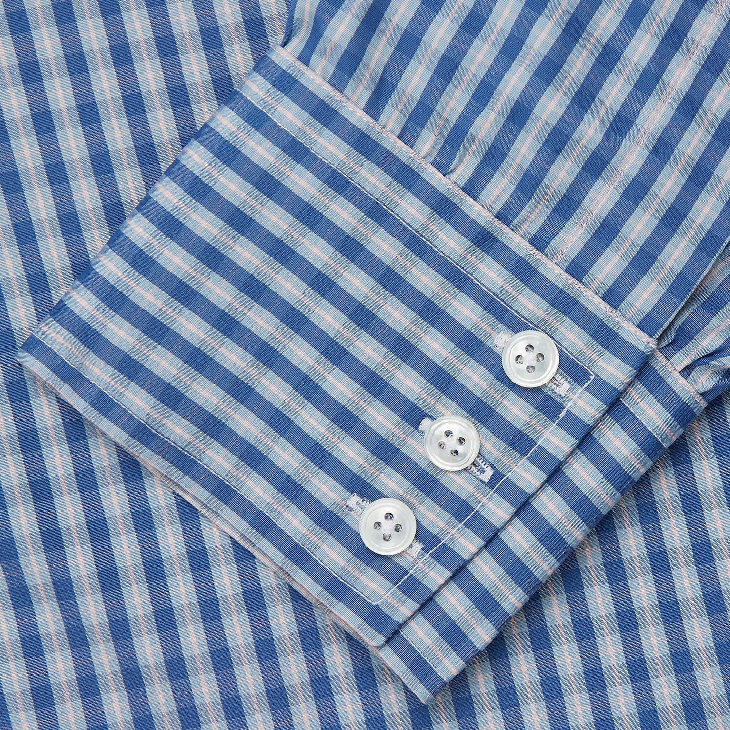 View 3 of product The Turnbull & Asser Navy Multi Check Cotton Regular Fit Mayfair Shirt features long sleeves, button-down front, collar, and buttoned cuffs in a navy and white check pattern, shown against a plain white background.