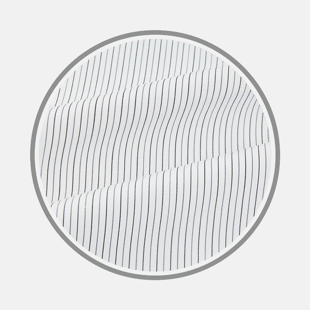 Close-up of Turnbull & Asser’s Midnight Blue And Grey Fine Stripe Fabric, featuring narrow vertical stripes, displayed inside a circular frame on a plain light background.