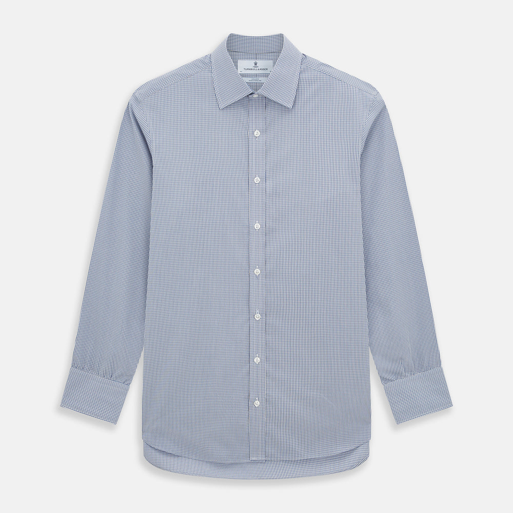The Turnbull & Asser Pale Blue Micro Graph Check Mayfair Shirt features a small blue and white check pattern, classic T&A collar, white buttons, and buttoned cuffs. Presented on a plain white background.