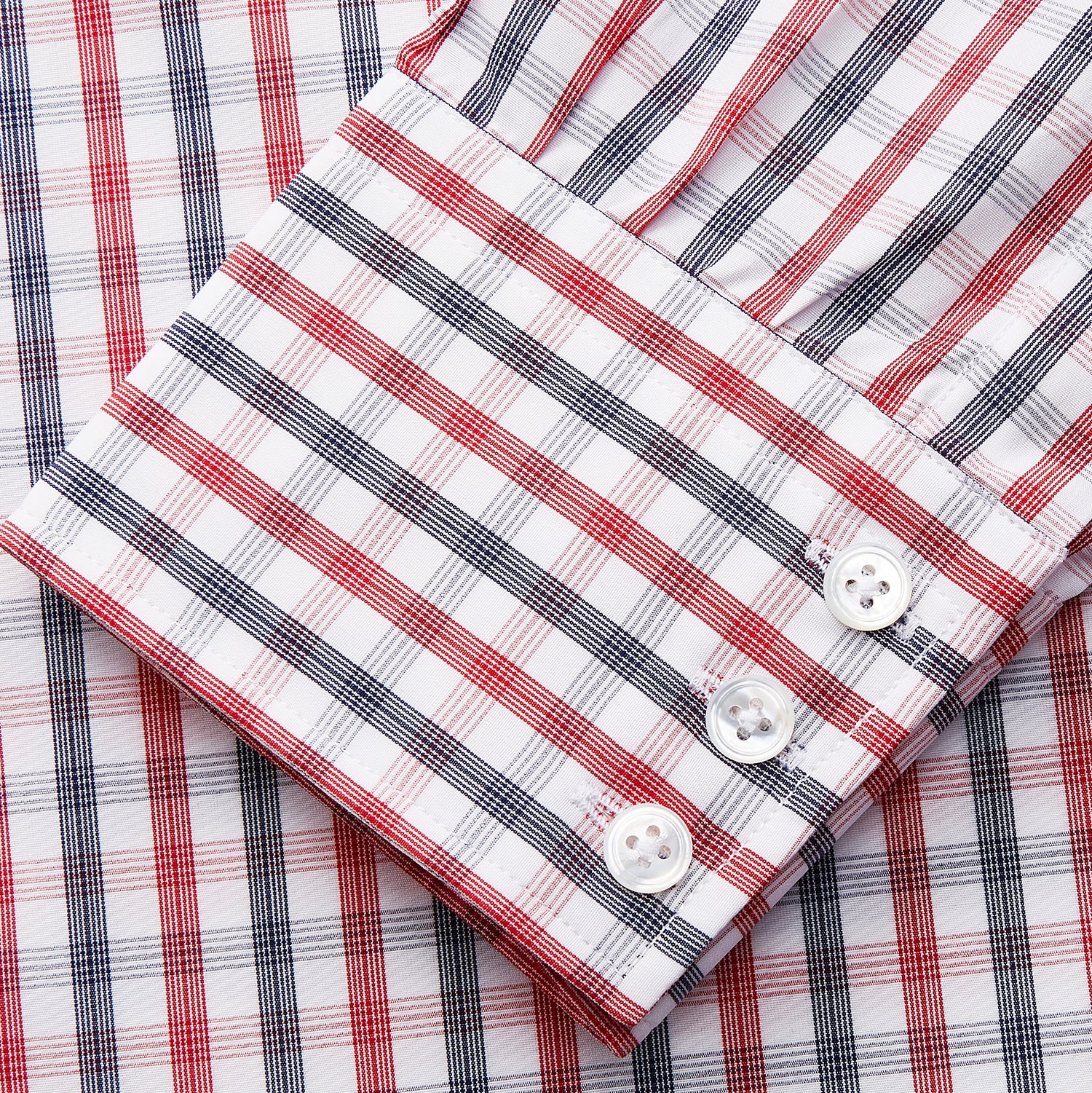 View 2 of product The Turnbull & Asser Navy and Red Check Cotton Regular Fit Mayfair Shirt features a classic T&A collar and long sleeves, shown laid flat on a white background.