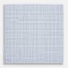 View 3 of product The Hand Rolled Blue Multi Graph Check Handkerchief by Turnbull & Asser features a white base with a blue grid and bold lines, resembling elegant graph paper, set against a clean white background.