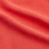 View 2 of product The Turnbull & Asser Women's Coral Pink Silk Thelma Pyjama Set features a long-sleeve button-up top with two front pockets and matching drawstring pants, shown on a white background.