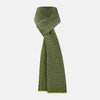 View 1 of product The Turnbull & Asser Graphite and Chartreuse Lemon Hexagon Cashmere Knitted Scarf features a geometric pattern in green and yellow tones, neatly folded to show both ends—an essential accessory with luxurious softness.