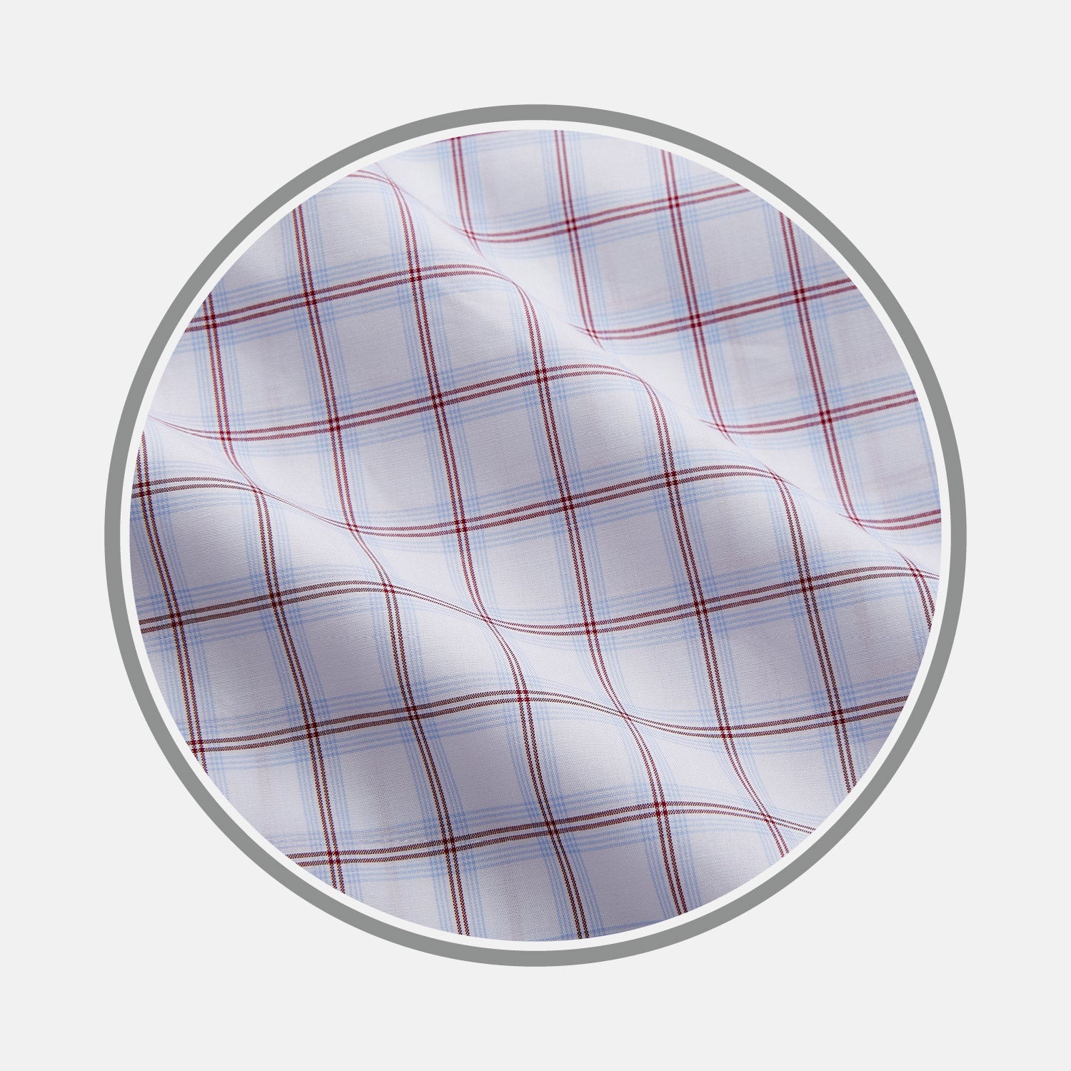 View 1 of product Close-up of Turnbull & Asser Red and Blue Multi Check Cotton Fabric, featuring a wavy texture and plaid pattern, displayed within a circular border.