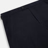 View 2 of product A pair of Midnight Blue Wool Henry Trousers by Turnbull & Asser, with a button closure and straight legs, shown against a plain white background.