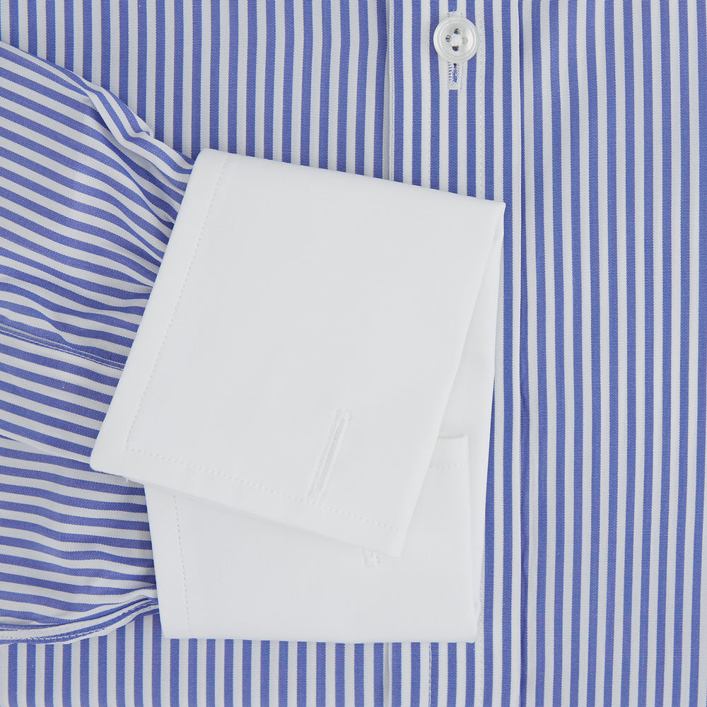 The Gekko Shirt by Turnbull & Asser features blue and white stripes with a white classic T&A collar and double cuffs, inspired by the Wall Street film. Shown on a plain white background.