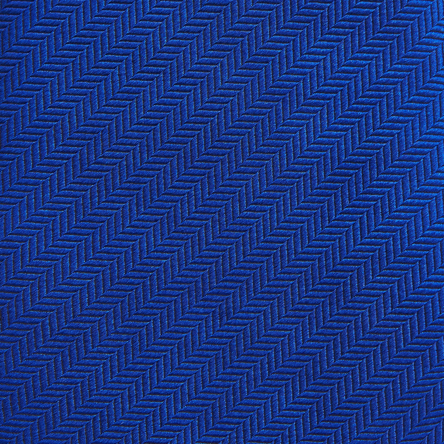View 3 of product The Turnbull & Asser Plain Herringbone Cruise Tie in bright blue, shown rolled up on a white background, features a subtle chevron pattern—an essential finishing touch for your smart look.
