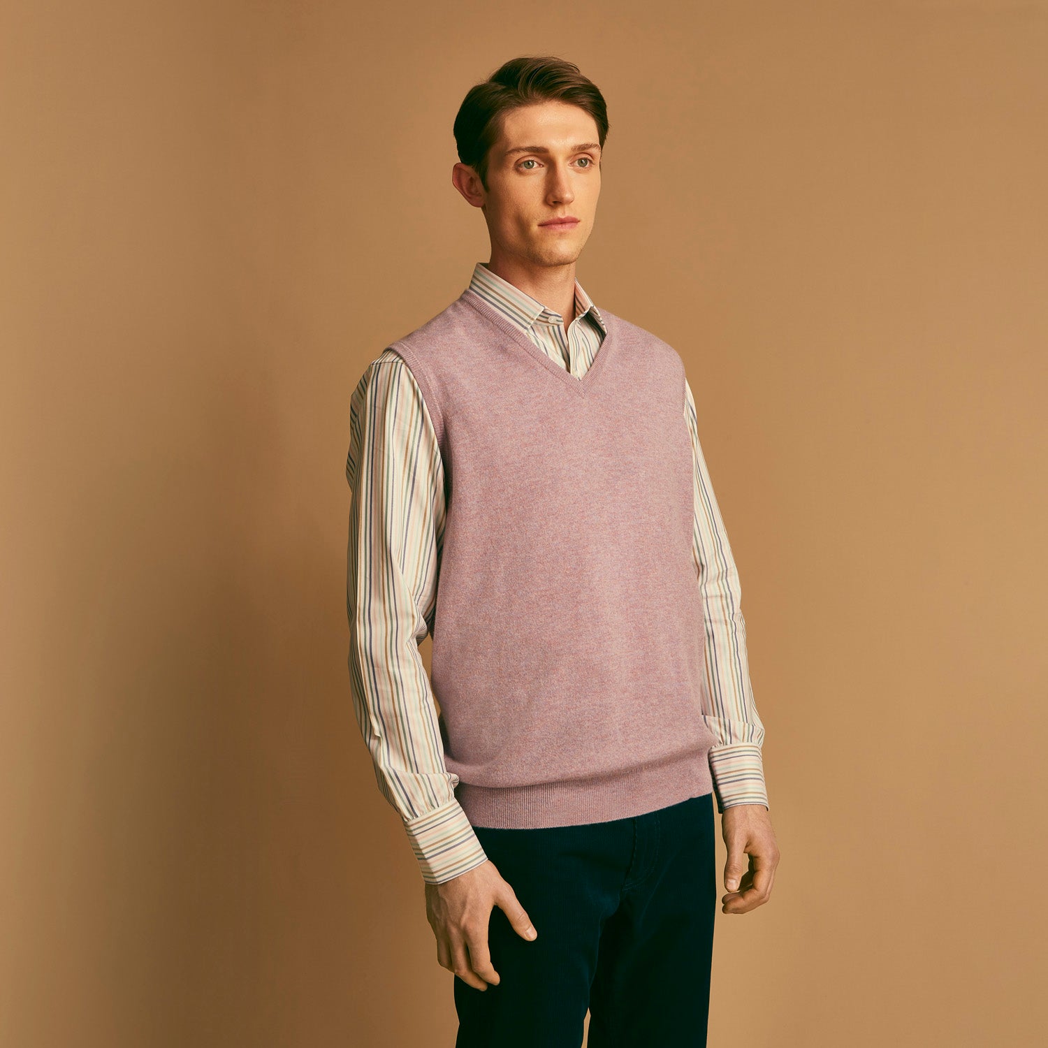 View 3 of product The Turnbull & Asser Lilac Heather Ifor Cashmere Slipover is a sleeveless, V-neck knit vest in soft cashmere, shown flat against a white background.