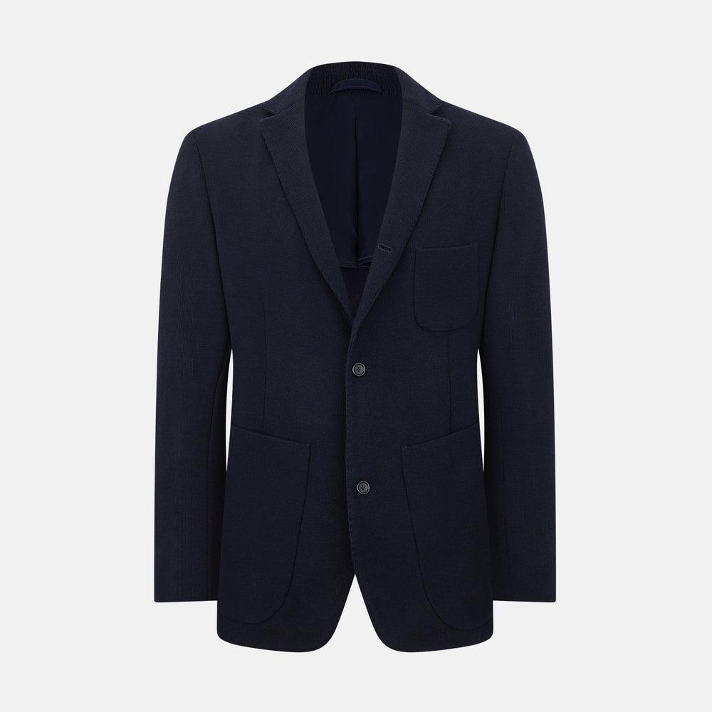 The Navy Knitted Oxford Blazer by Turnbull & Asser features notch lapels, two front buttons, a chest pocket, and two lower patch pockets, shown against a plain white background.