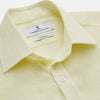 View 2 of product The Turnbull & Asser Yellow Linen Regular Fit Mayfair Shirt is a long-sleeve button-up with a collar and buttoned cuffs, shown laid flat on a white background.