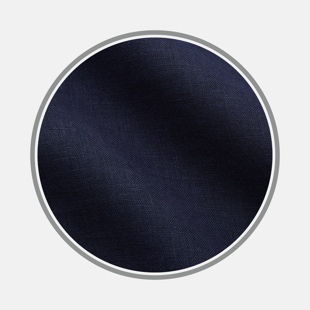 A close-up of Turnbull & Asser's Plain Navy Hemp Cotton Fabric displays its subtle texture within a circular gray-bordered frame on a white background.