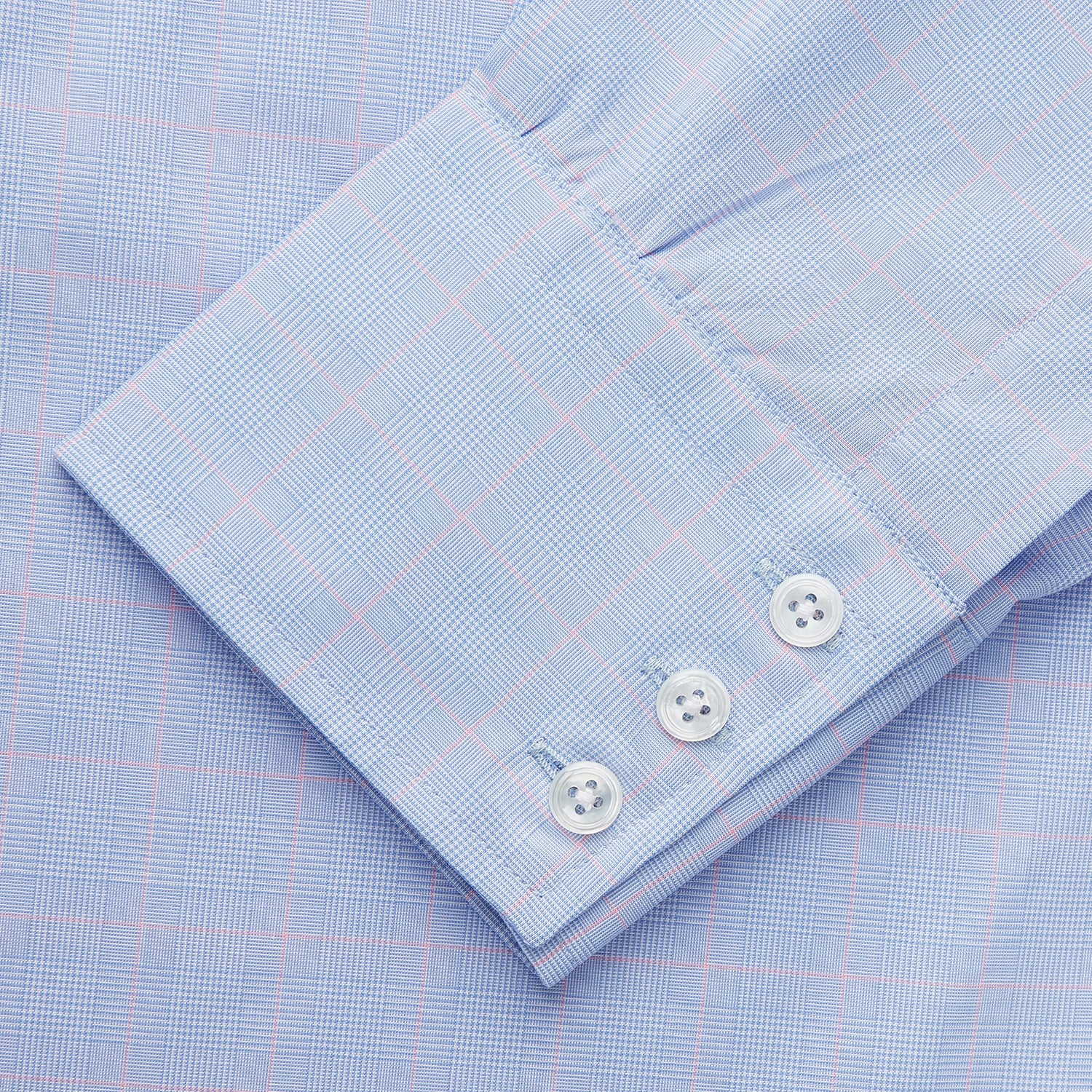 View 4 of product A Blue and Red Prince of Wales Check Mayfair Shirt by Turnbull & Asser, featuring long sleeves, a spread collar, buttoned cuffs, and button-up front, is laid flat on a white background.