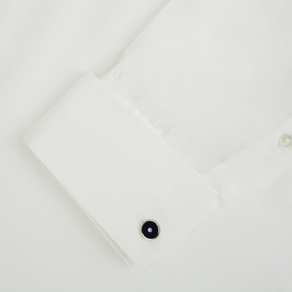 Turnbull & Asser's Navy Gemstone Circle Cufflinks feature round sterling silver with black enamel centers and a clear gemstone, shown on a white background.