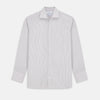 View 1 of product The Turnbull & Asser Sandstone Multi Stripe Cotton Tailored Fit Shelton Shirt features subtle vertical stripes, a pointed collar, and long sleeves, shown flat on a plain white background.